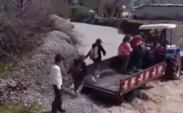 Silopi’de eğitim mesaisi: Debisi yükselen dereyi traktör sırtında aştılar!